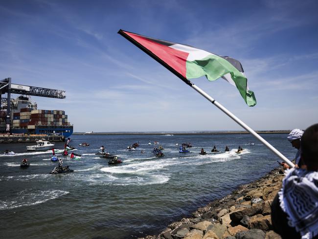 SYDNEY, AUSTRALIA. NCA NewsWire Photos. NOVEMBER 11TH, 2023. Jetskis with Palestinian flags during a pro-Palestine protest to attempt to block an Israel ZIM Shipping boat takes place at Port Botany foreshore boat ramp today.  Picture: NCA NewsWire/ Dylan Robinson