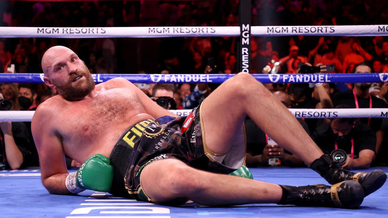 LAS VEGAS, NEVADA - OCTOBER 09: Tyson Fury reacts after a knock down by Deontay Wilder during their WBC Heavyweight Championship title fight at T-Mobile Arena on October 09, 2021 in Las Vegas, Nevada. (Photo by Al Bello/Getty Images)