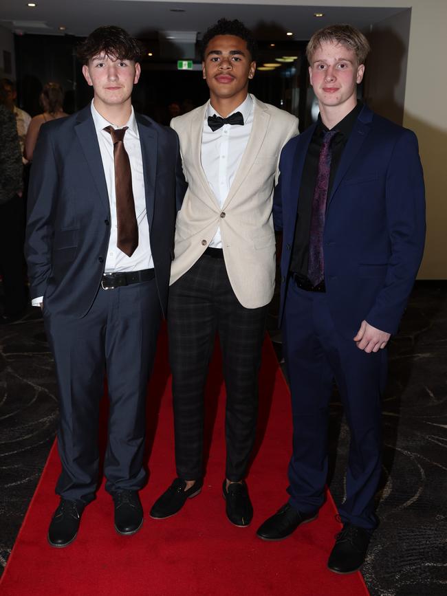 MELBOURNE, AUSTRALIA – JUNE 14 2024 Brody Flynn, Anthony Daley and Ryan Mellon attend the Lowanna College Senior Formal 2024 at the Moe Racing Club Picture: Brendan Beckett