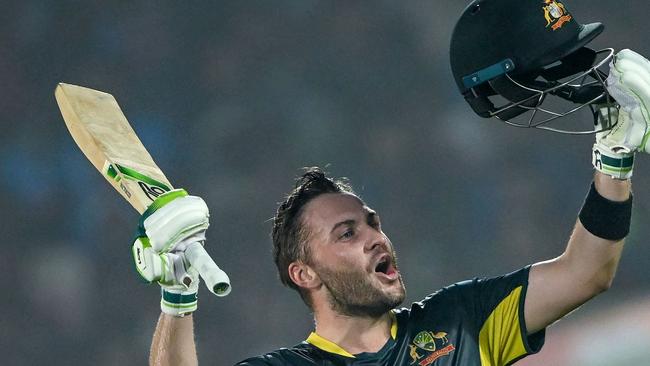 Australia's Josh Inglis celebrates after scoring a century (100 runs) during the first Twenty20 international cricket match between India and Australia at the Y.S. Rajasekhara Reddy Cricket Stadium in Visakhapatnam on November 23, 2023. (Photo by DIBYANGSHU SARKAR / AFP)