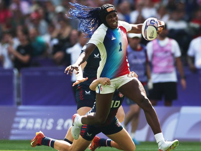 PARIS, FRANCE - JULY 29: Seraphine Okemba #1 of Team France is tackled by Steph Rovetti #10 of Team United States during the Women's Rugby Sevens Pool C match between France and United States on day three of the Olympic Games Paris 2024 at Stade de France on July 29, 2024 in Paris, France. (Photo by Michael Steele/Getty Images)