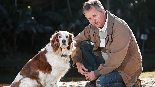 Mitch Geddes with his dog Cooper. Picture: Adam Yip