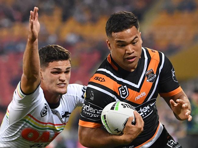 Esan Marsters (right) of the Tigers scores a try in the corner despite the efforts of Nathan Cleary (left) of the Panthers during the Round 9 NRL match between the Wests Tigers and the Penrith Panthers at Suncorp Stadium in Brisbane, Friday, May 10, 2019.  (AAP Image/Darren England) NO ARCHIVING, EDITORIAL USE ONLY