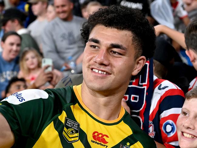 BRISBANE, AUSTRALIA - SEPTEMBER 25: Jojo Fifita of Australia gets a selfie with a fan after the International match between Australian Men's PMs XIII and PNG Men's PMs XIII at Suncorp Stadium on September 25, 2022 in Brisbane, Australia. (Photo by Bradley Kanaris/Getty Images)