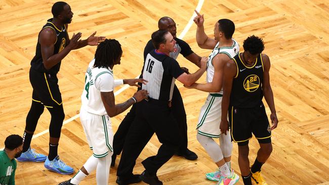 BOSTON, MASSACHUSETTS - JUNE 08: Grant Williams #12 of the Boston Celtics and Draymond Green #23 of the Golden State Warriors argue in the second quarter during Game Three of the 2022 NBA Finals at TD Garden on June 08, 2022 in Boston, Massachusetts. NOTE TO USER: User expressly acknowledges and agrees that, by downloading and/or using this photograph, User is consenting to the terms and conditions of the Getty Images License Agreement. (Photo by Elsa/Getty Images)