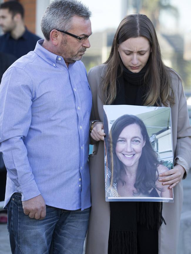 Borce and Sarah Ristevski, who is holding a picture of her mother Karen. Picture: Sarah Matray