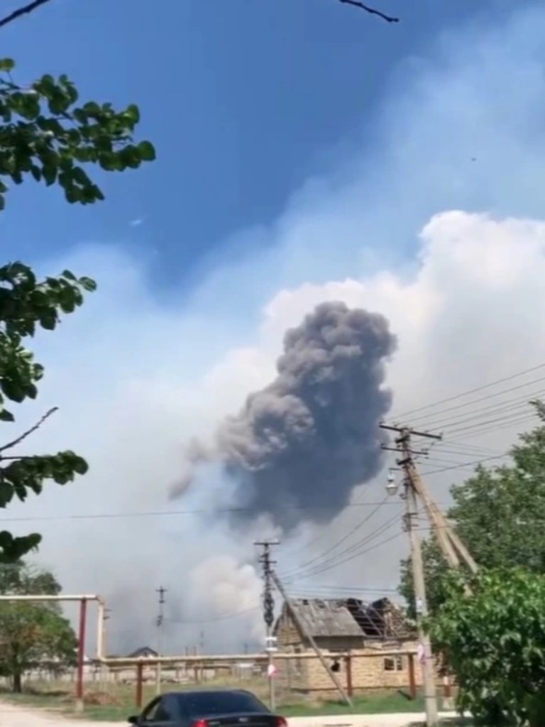 A huge plume of smoke rises after drones allegedly hit an oil depot and airfield. Picture: Telegram