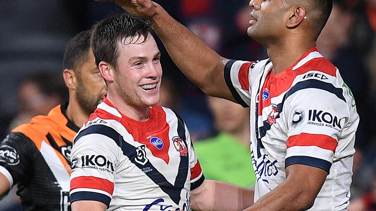 Daniel Tupou of the Roosters (right) celebrates with Luke Keary after scoring a try.