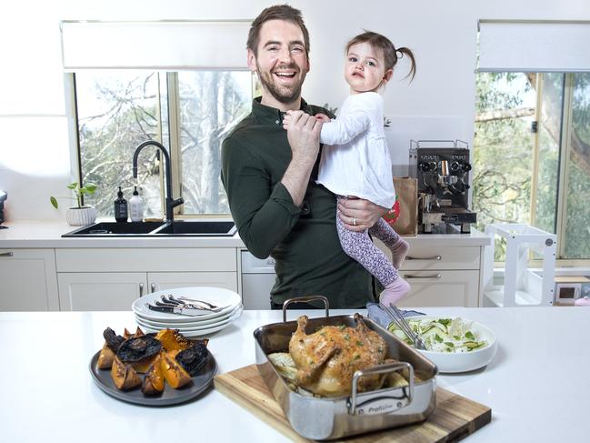 Chef Callum Hann with his daughter Elle Hann 22 months serving Roast Chicken with Fennell and Thyme ,Shaved Zucchini Salad and Balsamic Roasted Pumpkin and Mushrooms for a fathers day meal.Tuedsday, August,24,2021.Picture Mark Brake