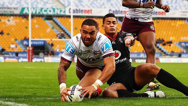 Dylan Walker dives over to score a try for the Sea Eagles.