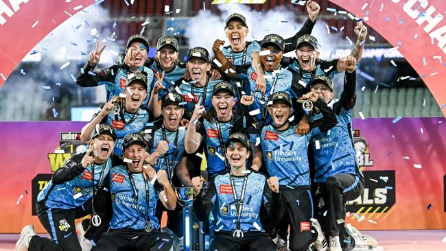 ADELAIDE, AUSTRALIA - DECEMBER 02:The Strikers celebrate on the podium  after winning  the WBBL Final match between Adelaide Strikers and Brisbane Heat at Adelaide Oval, on December 02, 2023, in Adelaide, Australia. (Photo by Mark Brake - CA/Cricket Australia via Getty Images)