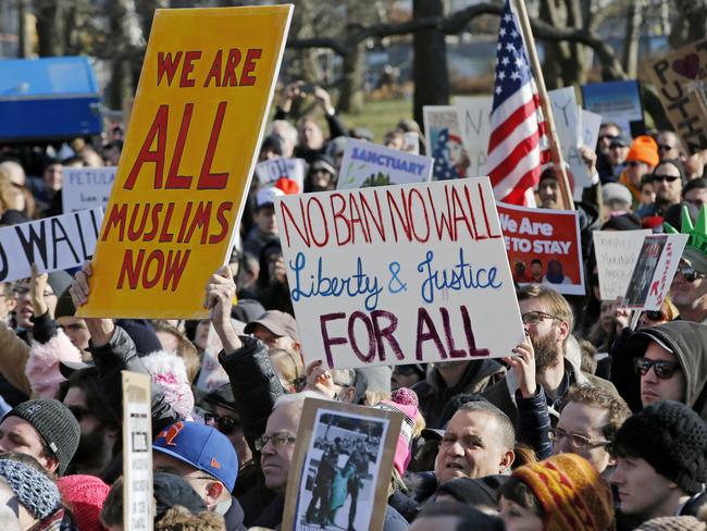 Protesters and immigrants rights advocates gathered at Castle Clinton National Monument, the physical departure and arrival point for tours of the Statue of Liberty on Sunday in New York. Picture: Kathy Willens/AP