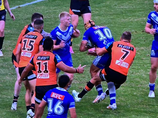 Wests Tigers Aidan Sezer has been charged for this tackle. Pic: Fox League