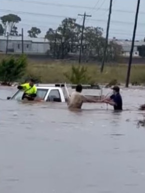 A man trapped in floodwater in Warwick.