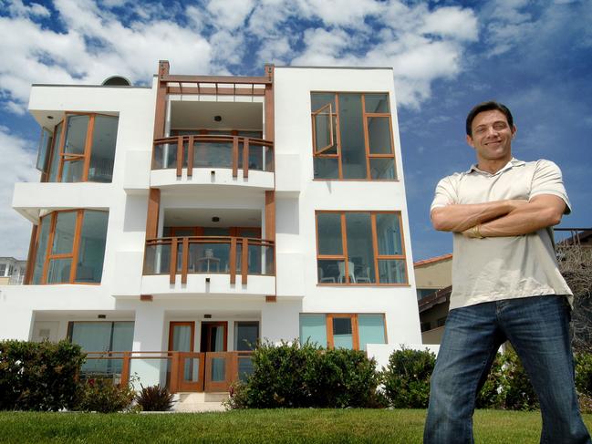 Jordan Belfort outside his new multimillion dollar home on the beach front. Money magazine Forbes once referred to him as “a twisted version of Robin Hood, who robs from the rich and gives to himself and his merry band of brokers.”