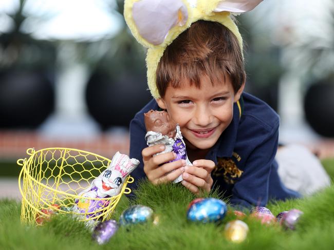 Elliott, 7, gets an early start on his Easter chocolate binge. Picture: Tara Croser