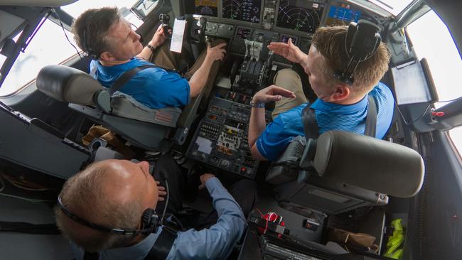 Dennis Muilenburg (lower L), CEO of Boeing, joins Boeing test pilot for a flight demo of updated MCAS software on a 737 MAX. Picture: AFP