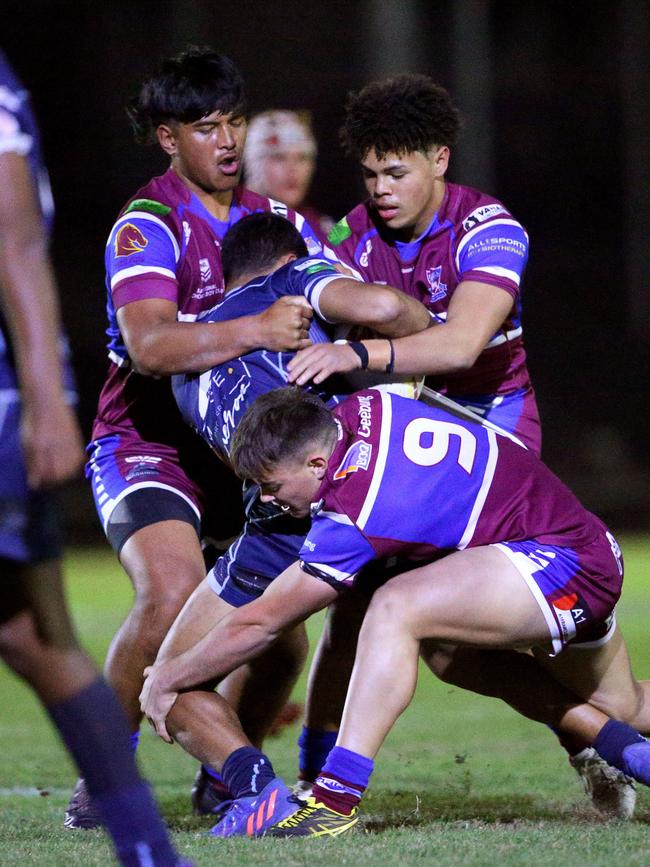 Jai Camilleri, bottom, in a three man tackle Picture David Clark