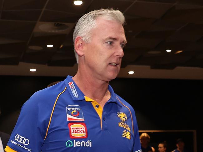 PERTH, AUSTRALIA - JULY 09: Adam Simpson walks in a press conference with Don Pyke (WCE CEO) and Paul Fitzpatrick (WCE Chair) after the West Coast Eagles and senior coach Adam Simpson mutually agreed that his 11-year tenure at the club will come to an end during a West Coast Eagles AFL press conference at Mineral Resources Park on July 09, 2024 in Perth, Australia. (Photo by Paul Kane/Getty Images)