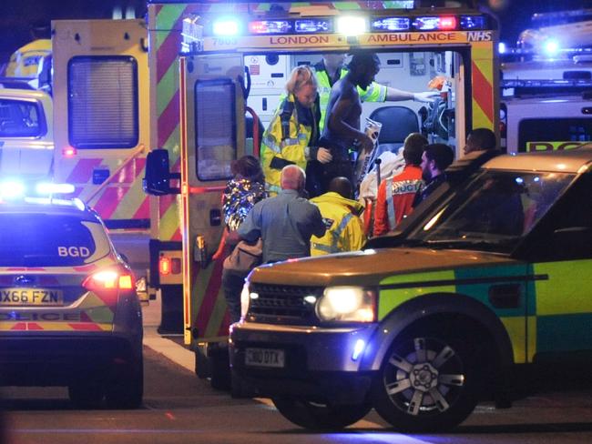 Members of the emergency services attend to victims of a terror attack on London Bridge. Picture: AFP