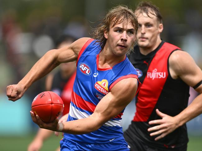 Ryley Sanders fires off a handball. Picture: Quinn Rooney/Getty Images