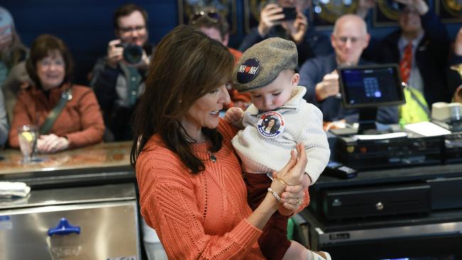 Nikki Haley gets to grips with future voter in Concord on Monday. Picture: AFP