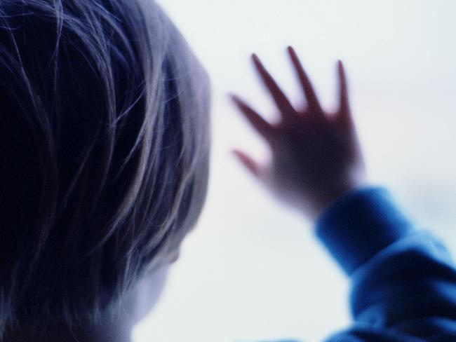 Generic image silhouette of young child with hands pressed against window. (Getty Images)