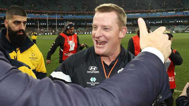 A happy Michael Voss shakes hands with president Luke Sayers after the Blues big win over the Pies. Picture: Michael Klein