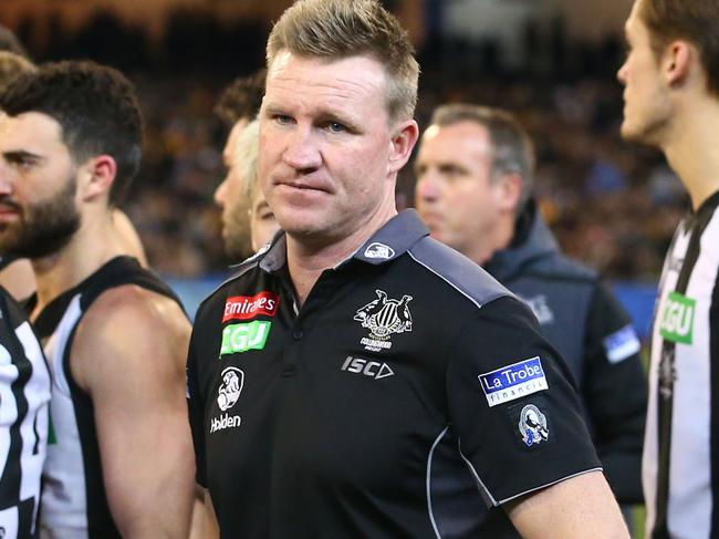 MELBOURNE, VICTORIA - JULY 02:  Nathan Buckley, coach of the Magpies speaks to his team during a quarter time break during the round 15 AFL match between the Hawthorn Hawks and the Collingwood Magpies at Melbourne Cricket Ground on July 2, 2017 in Melbourne, Australia.  (Photo by Scott Barbour/AFL Media/Getty Images)