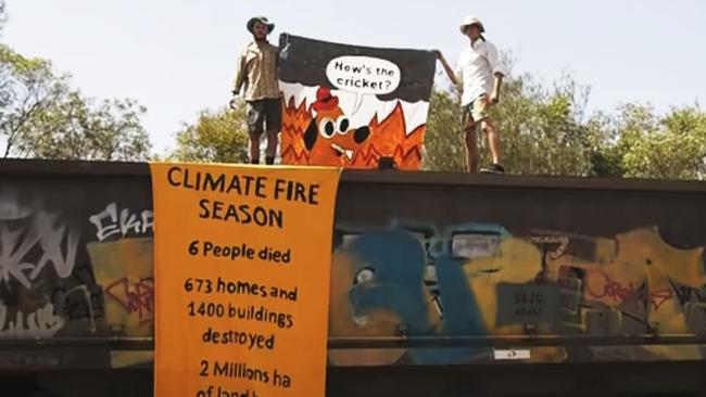 Extinction Rebellion protesters with banners on train. Picture: Supplied