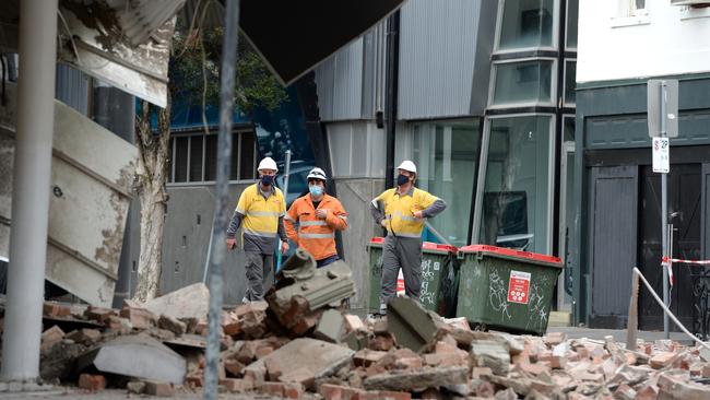 A damaged building on Chapel Street is surveyed. Picture: NCA NewsWire / Andrew Henshaw