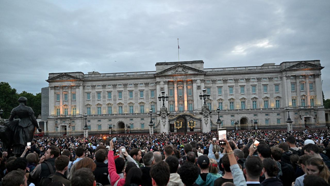 The Union flag has been lowered to half mast as people gather at Buckingham Palace in the wake of the Queen’s death. Picture: Samir Hussein/WireImage.