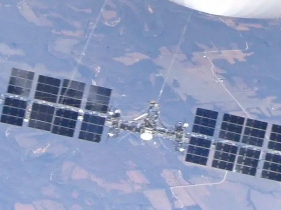 A close up of the massive payload suspended below the balloon, appearing to show solar panels, a white dish, and propellers. Picture: Supplied