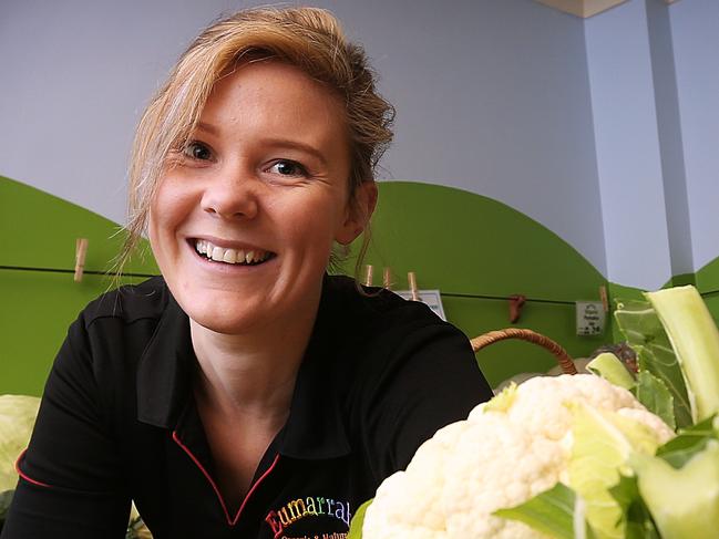 Eumarrah shop assistant Emily Rawlings with chemical-free cauliflowers