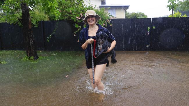 Toni Wright rescues little Louis from 9th Avenue Railway Estate. Picture: Adam Head