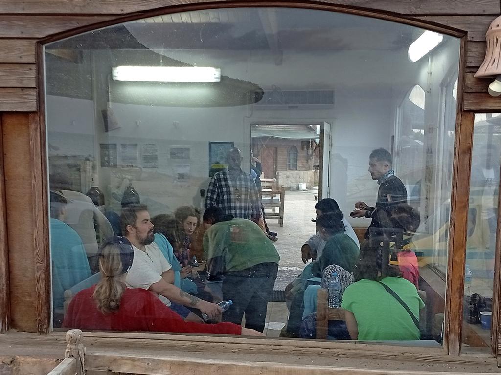 Survivors rest at a coffee shop in Marsa Alam, Egypt on Monday. Picture: AP