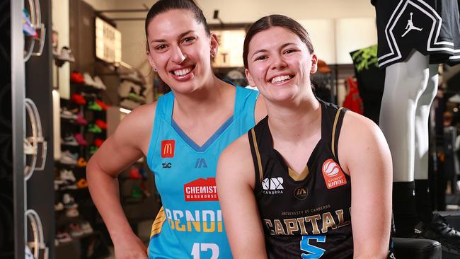 MELBOURNE, AUSTRALIA - OCTOBER 23: Marianna Tolo of the Bendigo Spirit and Jade Melbourne of the UC Capitals pose for a photo during the WNBL 24/25 Season Launch at Foot Locker Melbourne Central on October 23, 2024 in Melbourne, Australia. (Photo by Kelly Defina/Getty Images)