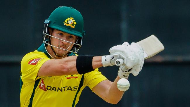 Australia's batsman D'Arcy Short watches the ball after playing a shot during the fifth T20 cricket match between Pakistan and Australia of a T20 tri-series including host nation Zimbabwe at The Harare Sports Club in Harare on July 5, 2018. / AFP PHOTO / Jekesai NJIKIZANA