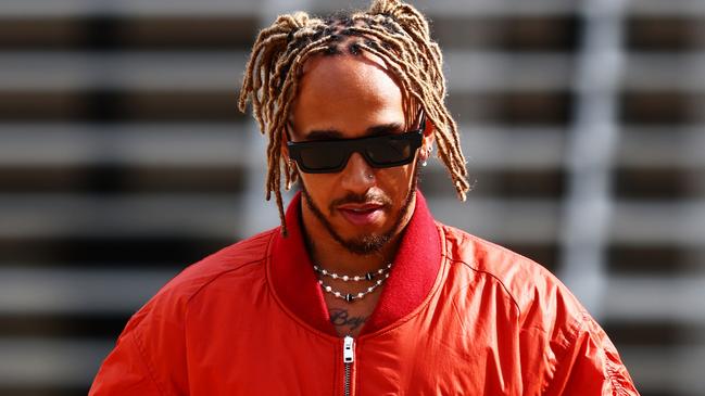 BAHRAIN, BAHRAIN - MARCH 17: Lewis Hamilton of Great Britain and Mercedes walks in the Paddock during previews ahead of the F1 Grand Prix of Bahrain at Bahrain International Circuit on March 17, 2022 in Bahrain, Bahrain. (Photo by Mark Thompson/Getty Images)