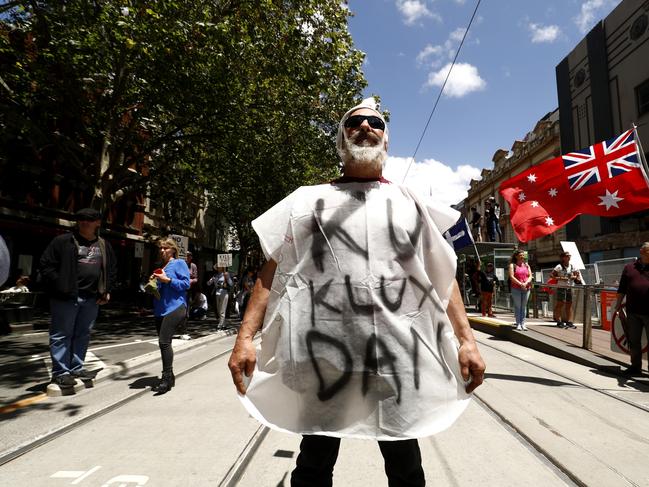 A protester near the steps of Parliament House in Melbourne. Photo by Darrian Traynor/Getty Images