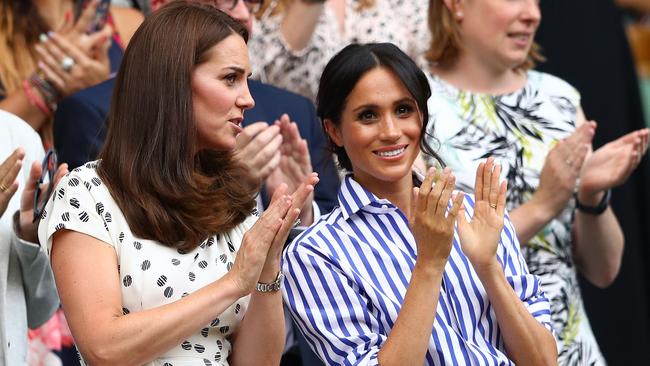 Catherine, Duchess of Cambridge and Meghan, Duchess of Sussex applaud ahead of the Wimbledon Ladies' Singles final match this year.