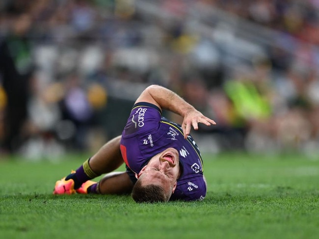 Cameron Munster writhes on the ground after tweaking his groin injury. Picture: NRL Imagery