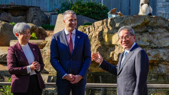 Foreign Minister Penny Wong, South Australian Premier Peter Malinauskas and Chinese Premier Li Qiang at the Adelaide Zoo on Sunday. Picture: Getty Images