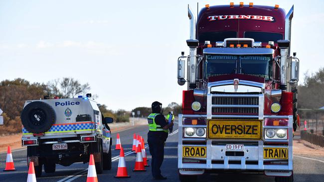 A truck is stopped on the South Australia and Northern Territory border. Picture Chloe Erlich