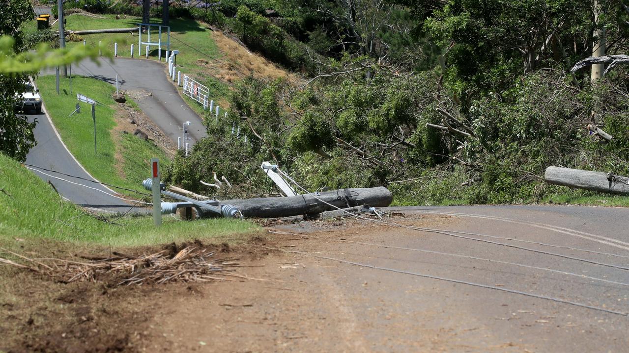 Fallen power lines and power poles have caused major traffic hazards across multiple roads in southeast Queensland after days of massive storms. Picture: NCA NewsWire / Scott Powick