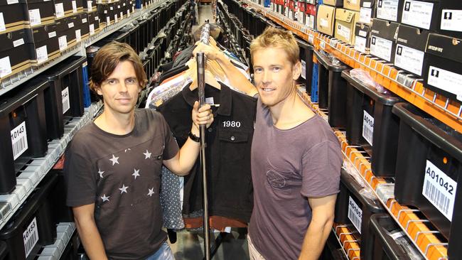 In better days. SurfStitch founders Lex Pedersen and Justin Cameron at their Burleigh Heads warehouse before the former stockmarket darling hit a reef.