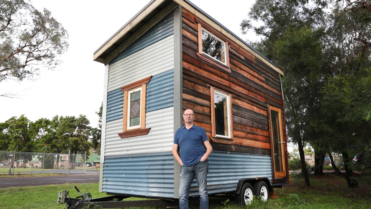 Guido Verbist outside the tiny house going to auction Saturday. Picture: Richard Dobson