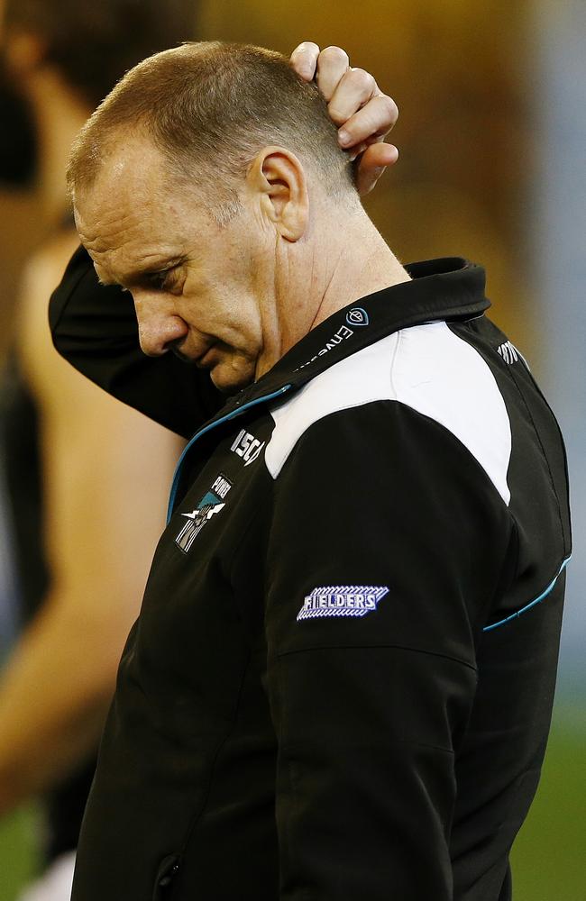 Ken Hinkley walks off the MCG after the 2014 preliminary final loss. Picture: Wayne Ludbey