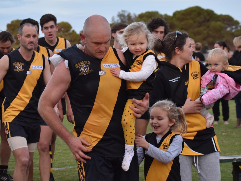 Joel Fitzgerald Kimba 1000th goal. Joel gets a hug from his family - eldest daughter Millie, wife Nicole and Sophie and Oakley (pink). Picture: Felicity Chinnery