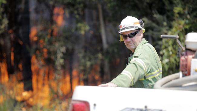 Michael Cassey, of Sustainable Timber Tasmania, attending the fire front south of Geeveston. Picture: RICHARD JUPE